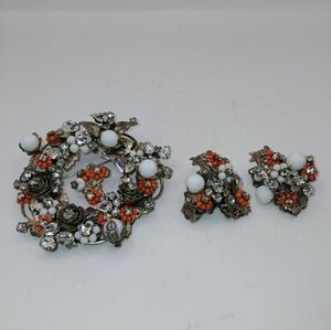 Unsigned Miriam Haskell brooch and clip on earrings